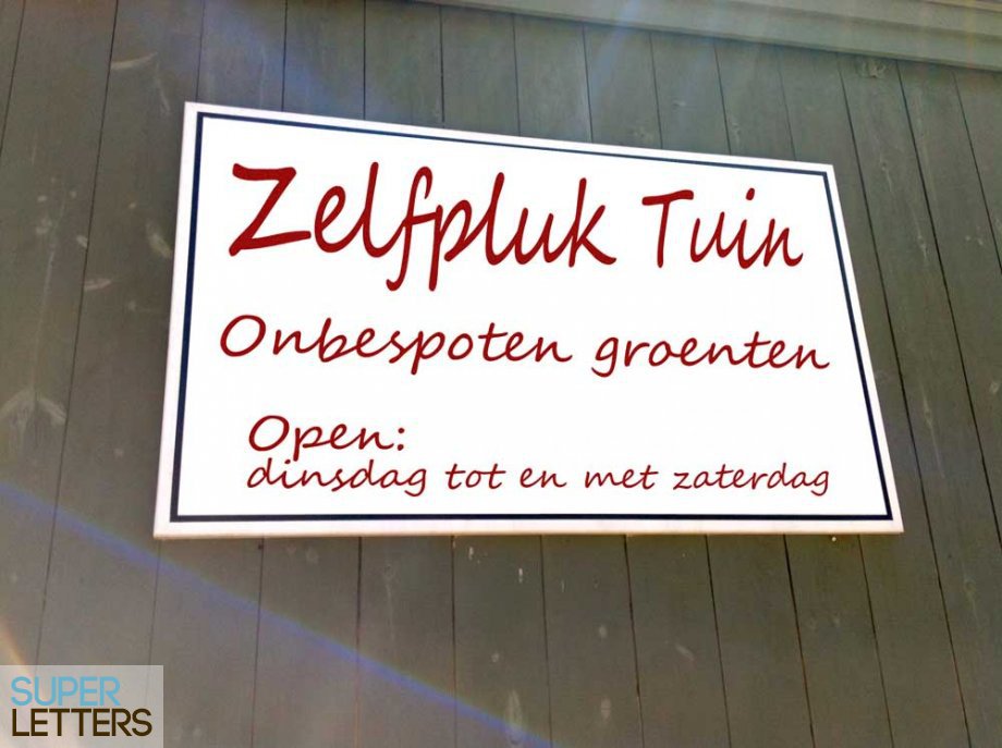 reclamebord plakken | Ons nieuwe bord.